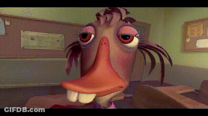 Big Nose Cartoon Character At Desk With Bulletin Board GIF