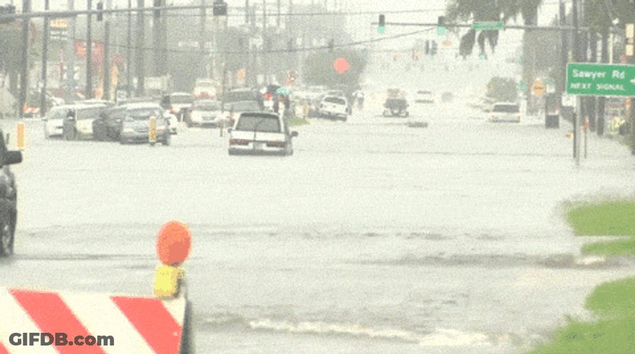 Biker Fall On The Flooding GIF
