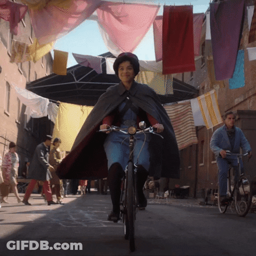 Biking Adventure In Cobblestone Alley GIF