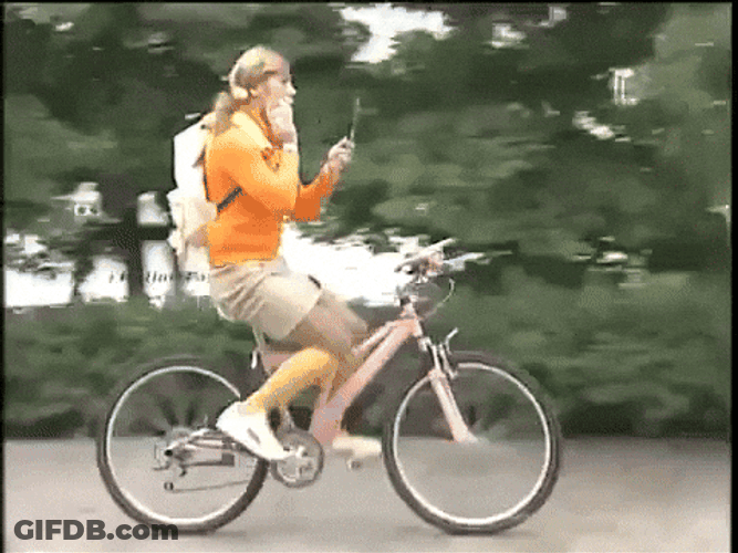 Biking While Doing Some Make Up GIF