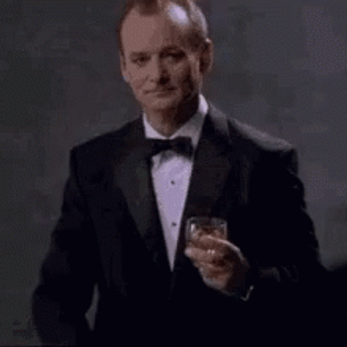 Bill Murray In Black Suit Holding A Glass Of Whiskey GIF