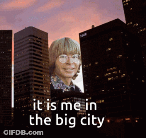 Billboard With Man In Glasses Saying It Is Me In The Big City GIF