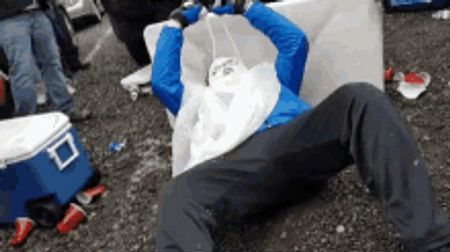 Bills Mafia Lying On A Table GIF