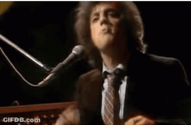 Billy Joel Smoking Cigar While Performing GIF