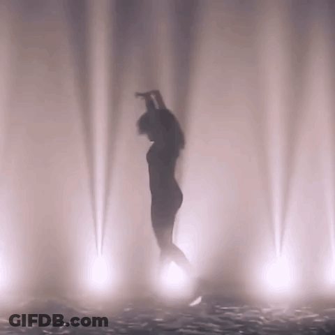 Bird Wearing Hat And Red Socks Walking In Snow GIF