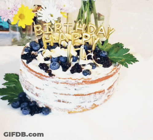 Birthday Cake With Blueberries And Candles Saying Happy GIF