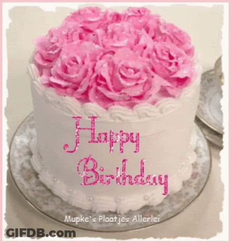 Birthday Cake With Candles And Confetti Saying Happy Birthday GIF
