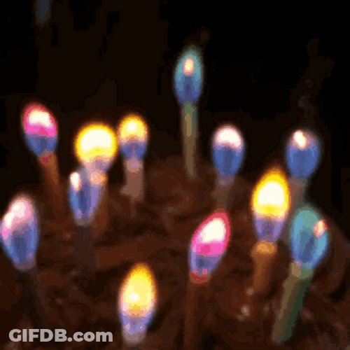 Birthday Candles With Colorful Flames GIF