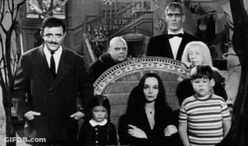 Black And White Addams Family Standing Together GIF