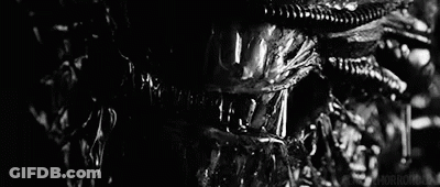 Black And White Alien Face With Water Dripping From Mouth GIF