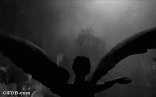 Black And White Angel Statue Wings Spread GIF