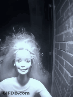 Black And White Barbie Doll With Brick Wall GIF