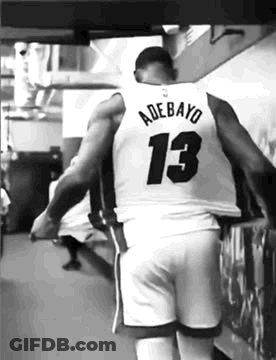 Black And White Basketball Player Walking In Locker Room GIF