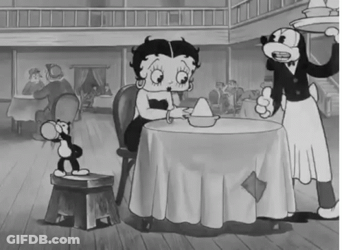 Black And White Betty Boop Sitting At Restaurant Table GIF