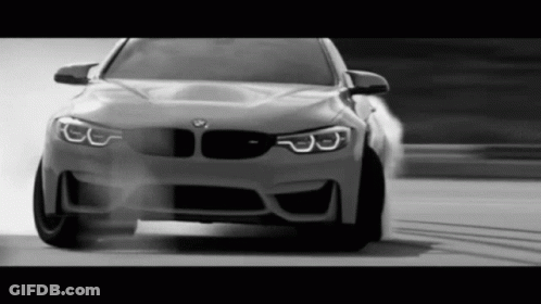 Black And White BMW Driving On Road GIF