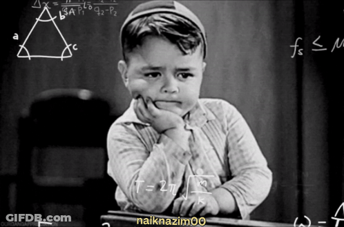Black And White Boy At Chalkboard With Math Problems GIF