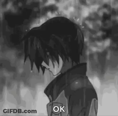 Black And White Boy Standing In Rain Saying Ok GIF