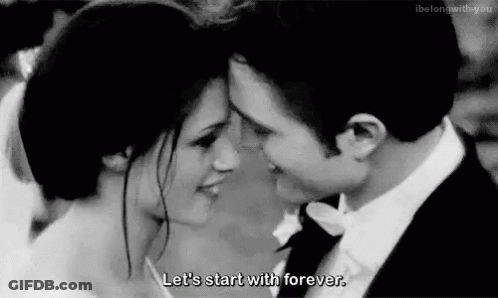 Black And White Bride And Groom Looking Into Each Others Eyes GIF