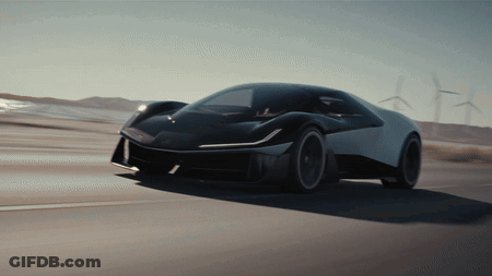 Black And White Car Driving Past Windmills GIF