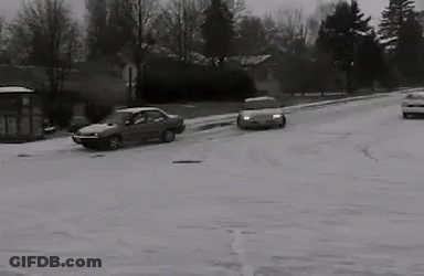 Black And White Car Driving Through Snow GIF