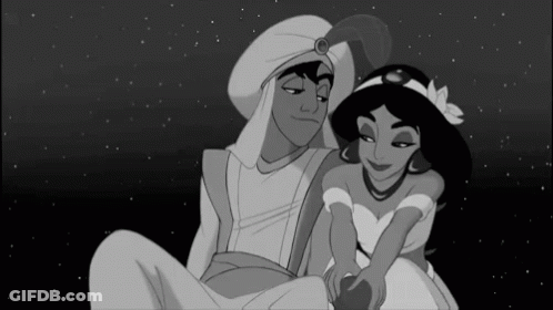 Black And White Cartoon Man And Woman Sitting GIF