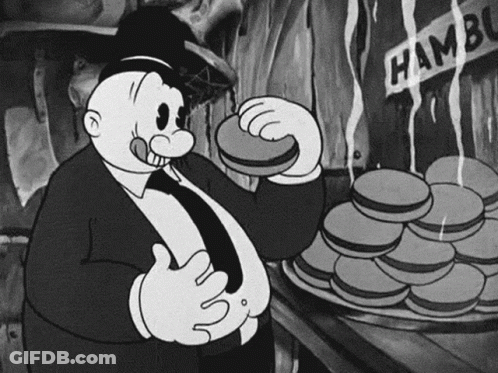 Black And White Cartoon Man Eating Hamburger Next To Pile GIF