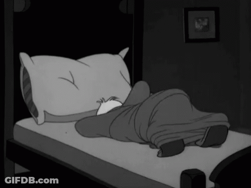Black And White Cartoon Person Laying On Bed With Pillow And Blanket GIF
