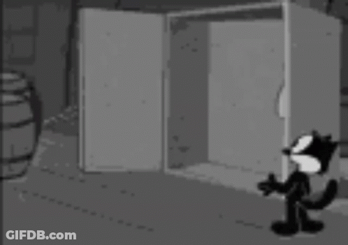 Black And White Cat Next To Safe With Ghosts GIF