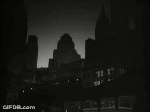 Black And White City At Night With Train GIF