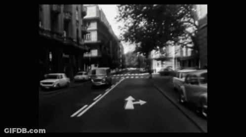Black And White City Street With Van GIF