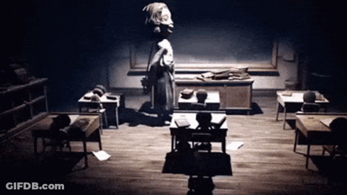 Black And White Classroom With Woman Standing GIF