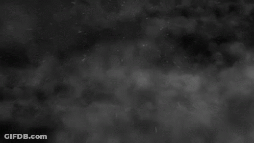 Black And White Cloudy Sky With Snow Falling GIF