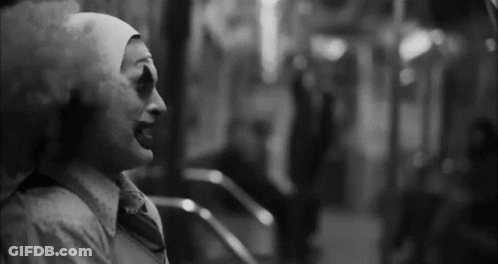 Black And White Clown In White Hat And Tie GIF