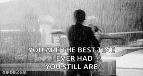 Black And White Couple Hugging In Rain With Quote GIF