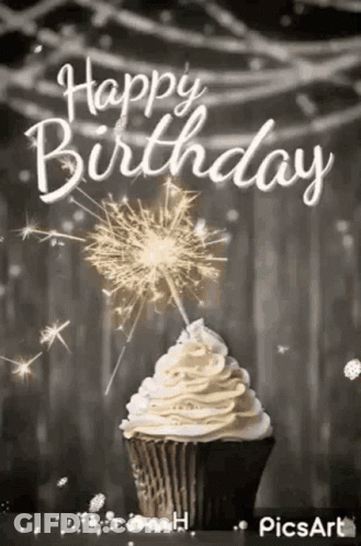 Black And White Cupcake With Whipped Cream And Sparklers GIF