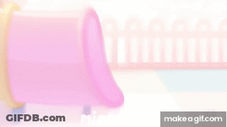 Black And White Dog Going Through Pink Tunnel GIF