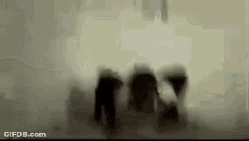 Black And White Face Behind Glass GIF