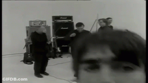 Black And White Group Of Men With Amps GIF