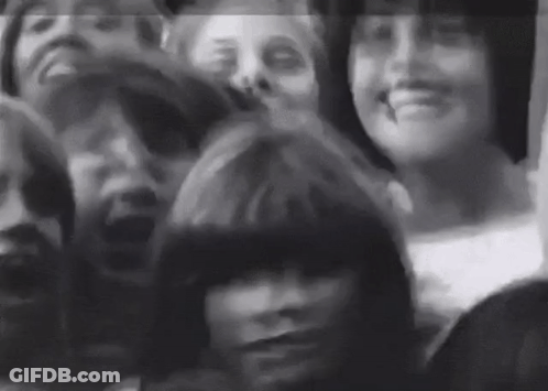 Black And White Group Sitting In Room GIF