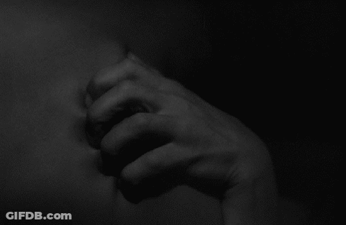 Black And White Hand In Dark GIF