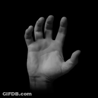 Black And White Hand Reaching In Dark GIF