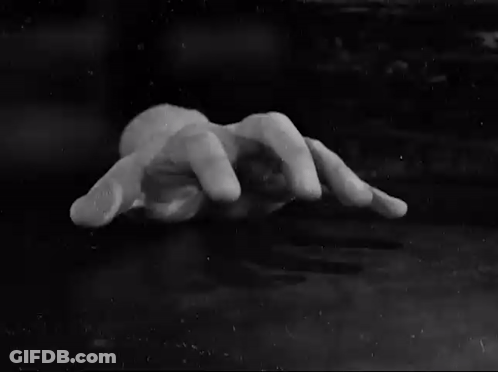 Black And White Hand Reaching Out GIF