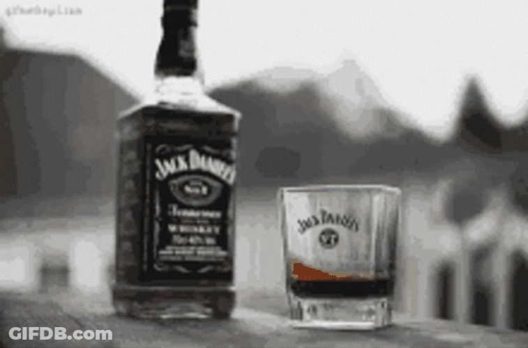 Black And White Jack Daniel's Bottle And Glass With Whiskey GIF
