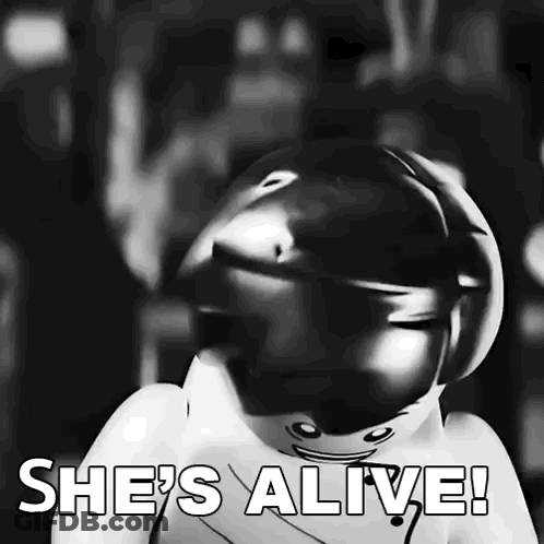 Black And White Lego Figure Saying She's Alive GIF