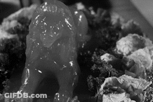 Black And White Lion Statue Covered In Jelly GIF