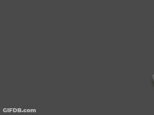 Black And White Logitech G304 Lightspeed Wireless Gaming Mouse On A Grey Background GIF
