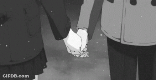 Black And White Man And Woman Holding Hands In Snow GIF