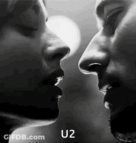 Black And White Man And Woman Kissing GIF