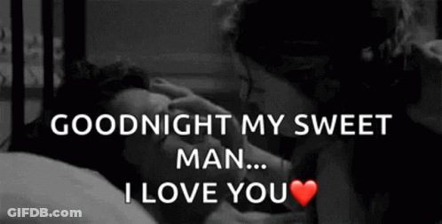 Black And White Man And Woman Kissing In Bed GIF