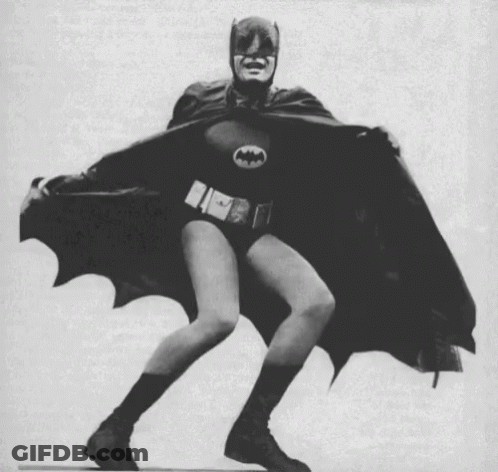 Black And White Man Dressed As Batman Dancing GIF